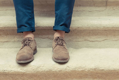 Low section of man standing on floor