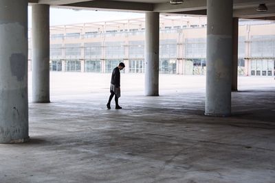 Men walking in empty parking lot