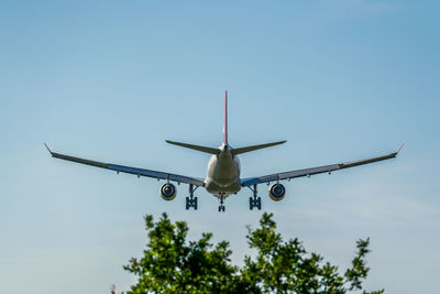 Airplane prepares for landing with extended landing gear