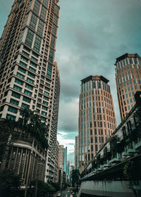 Low angle view of buildings against sky in city