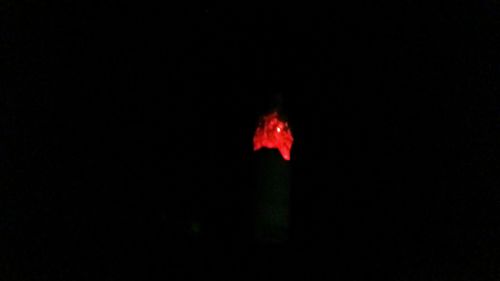 Close-up of red light at night