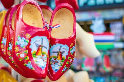 Close-up of wooden shoes for sale at market stall