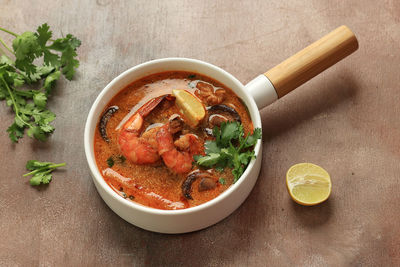 Thai shrimp curry soup in creamy coconut milk or tom kha kung, famous traditional thai food 