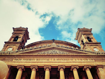 Low angle view of rotunda of mosta against sky