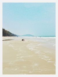 Scenic view of beach against clear sky