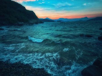 Scenic view of sea against sky at sunset