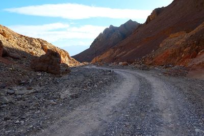 Scenic view of mountain road against sky