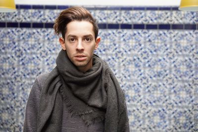 Portrait of young man standing outdoors