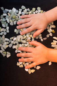 High angle view of woman hand with text