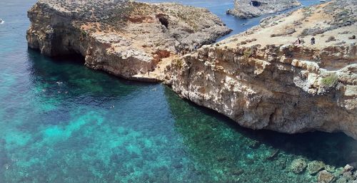 High angle view of rock formation in sea