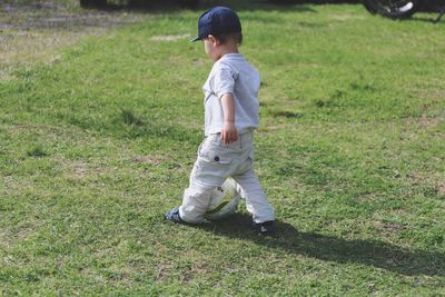 Boy standing on grass