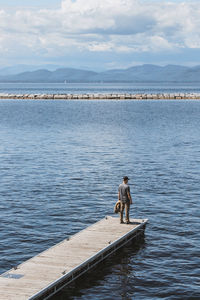 View of dog on sea against sky