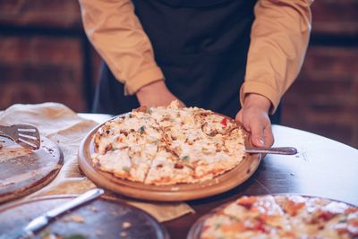 Midsection of man preparing food