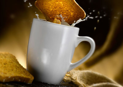 Close-up of milk cup on table