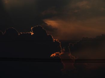 Silhouette trees against sky during sunset