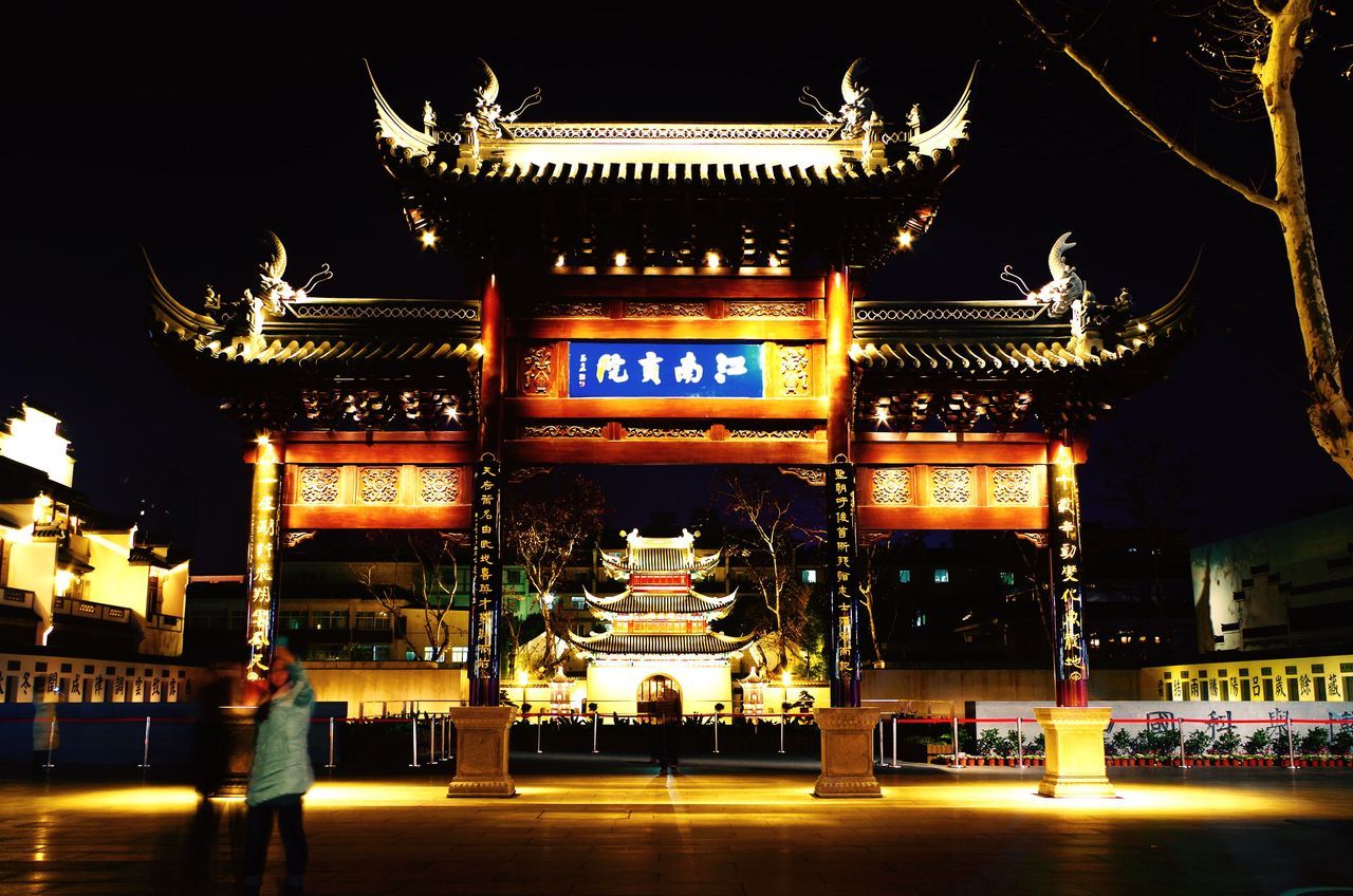 illuminated, night, architecture, built structure, text, building exterior, religion, non-western script, place of worship, spirituality, temple - building, travel destinations, famous place, tradition, western script, communication, culture, cultures, low angle view