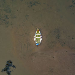 Done shot of boat moored at beach