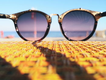 Close-up of sunglasses on glass