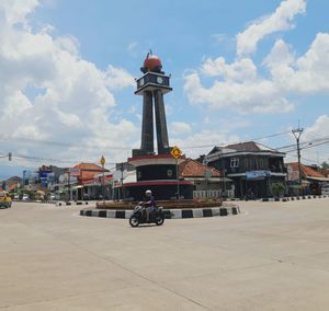 View of buildings against cloudy sky