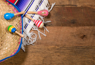 High angle view of multi colored pencils on hardwood floor