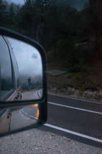 Reflection of car on side-view mirror