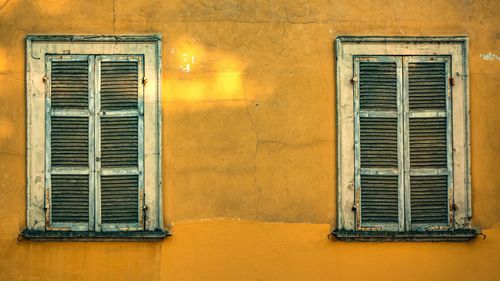 Closed window of old building