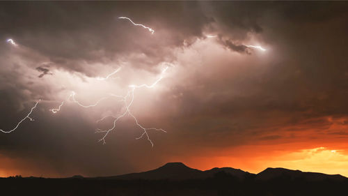 Lightning in sky during sunset