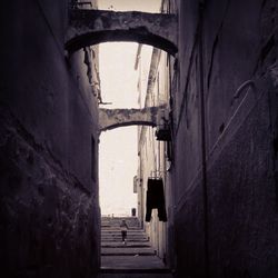 Narrow alley amidst buildings in city