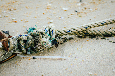 High angle view of fishing net on beach