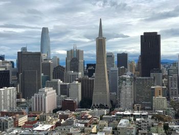 Modern buildings in city against sky