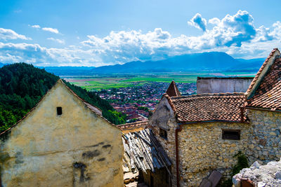 Panoramic view of old building and mountains against sky