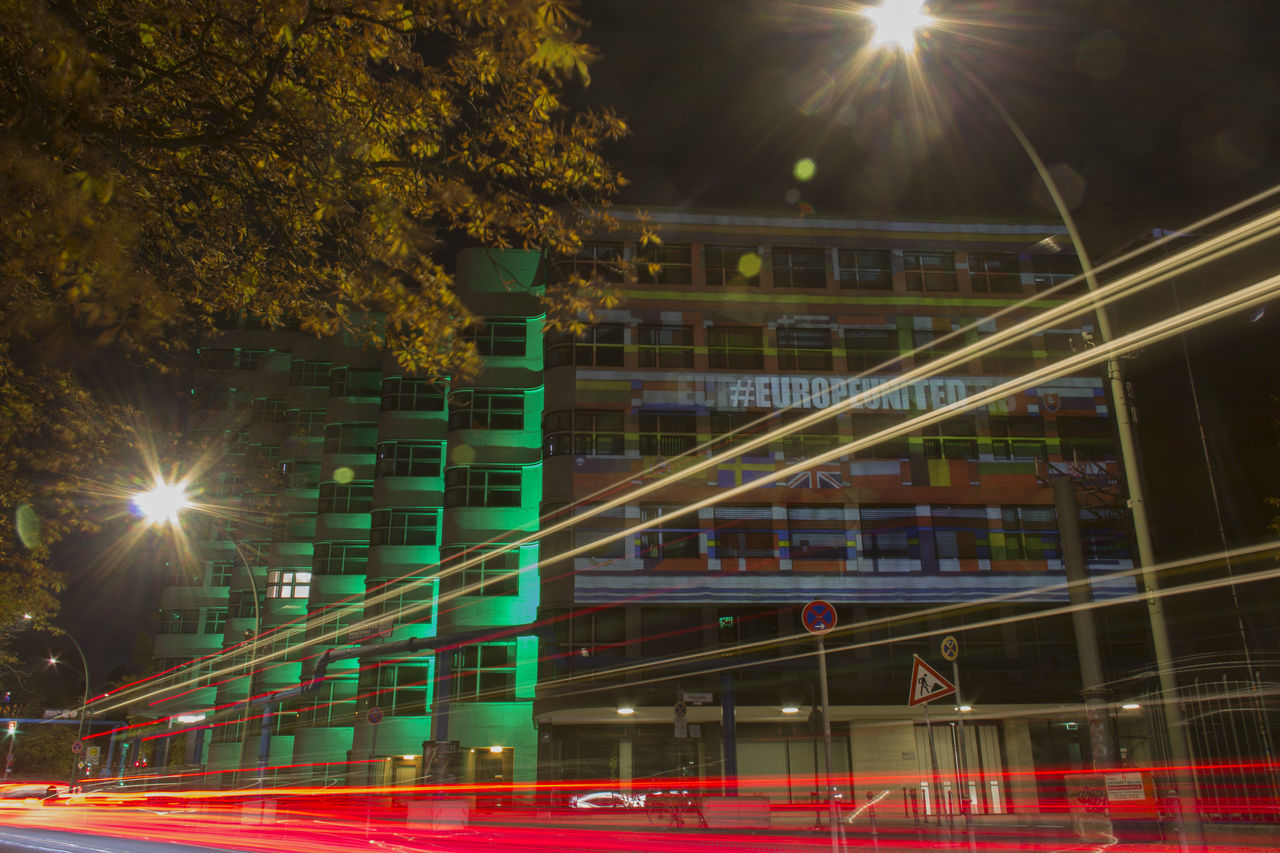 ILLUMINATED LIGHT TRAILS ON CITY STREET