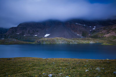 Scenic view of lake against mountains at gran paradiso national park