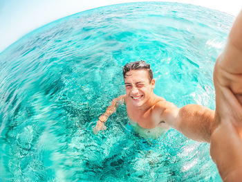 Portrait of man swimming in sea