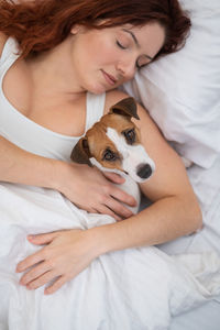 Portrait of young woman with dog