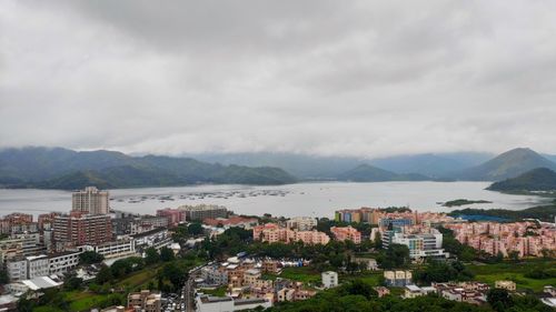 High angle view of townscape and mountains against sky