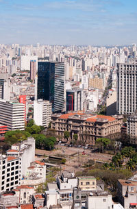 High angle view of buildings in city against sky