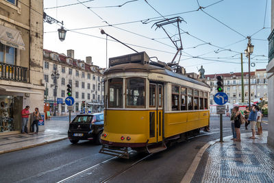 View of cars on street in city