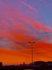 Low angle view of street light against sky during sunset