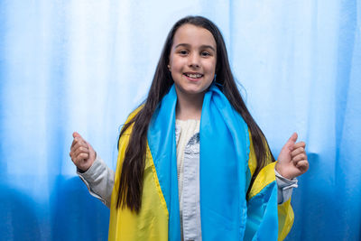 Portrait of girl with ukrainian flag