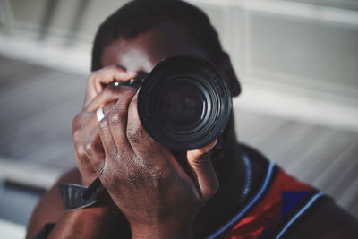 Portrait of man photographing outdoors