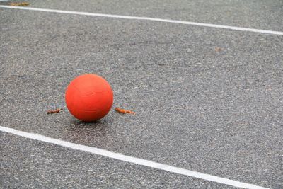 High angle view of basketball ball on street