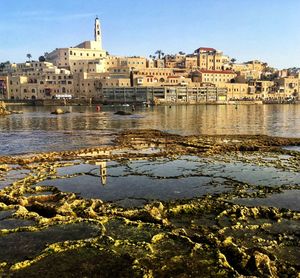 River by city against clear sky