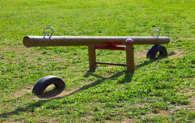 Seesaw at playground during sunny day