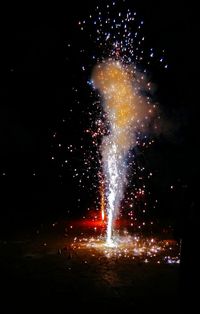 Illuminated fountain at night