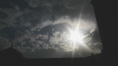 Low angle view of building against cloudy sky