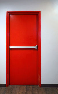 Red wooden door of house