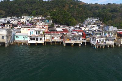 Buildings in town by sea