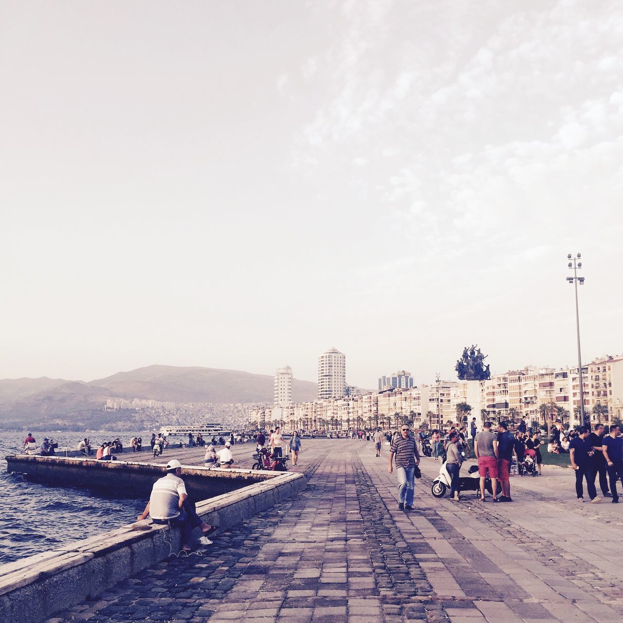 large group of people, architecture, built structure, building exterior, men, person, sky, city, lifestyles, leisure activity, mixed age range, the way forward, city life, walking, day, tourist, tourism, transportation, copy space