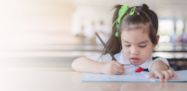 Portrait of cute girl looking at camera